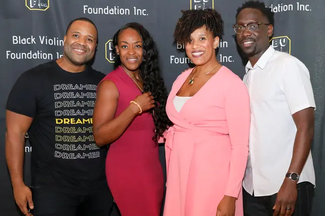 Kev Marcus and Wil Baptiste of Black Violin pictured with Anne Sylvester and Corryn Freeman, the administrators of Black Violin Foundation I