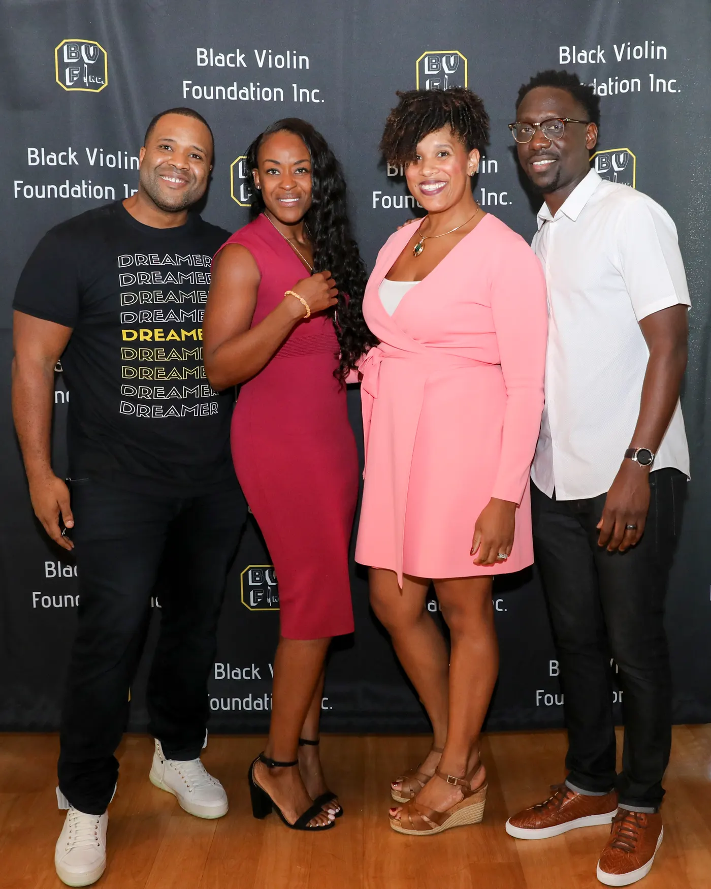 Kev Marcus and Wil Baptiste of Black Violin pictured with Anne Sylvester and Corryn Freeman, the administrators of Black Violin Foundation I